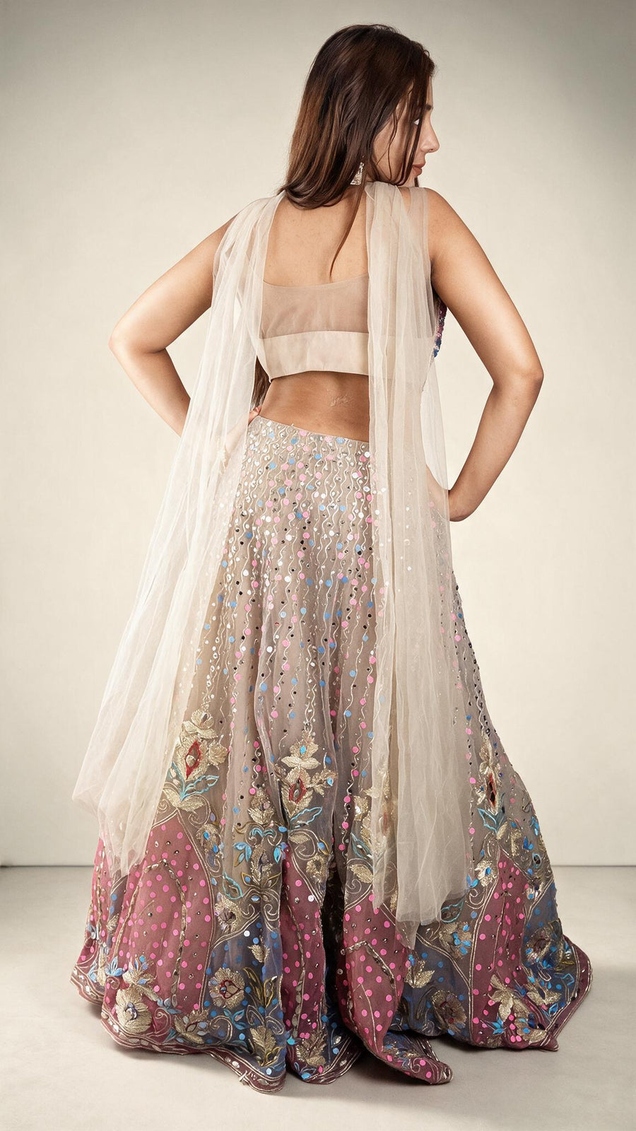 Beige Net Lehenga With Pink Sequin and Mirror Work — back view