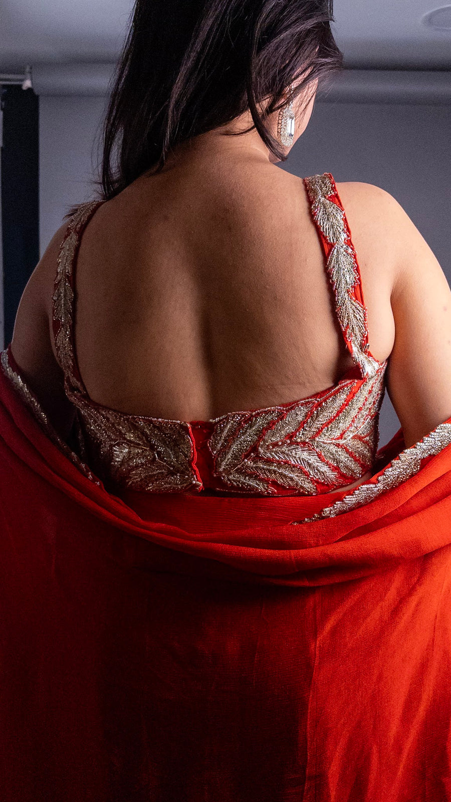 Orange Crepe Skirt Set With Zari Bustier and Cape — styling detail