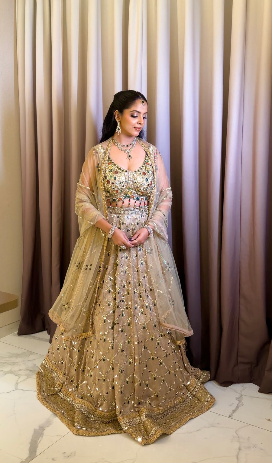 Champagne Net Lehenga With Stone and Mirror Work — front view