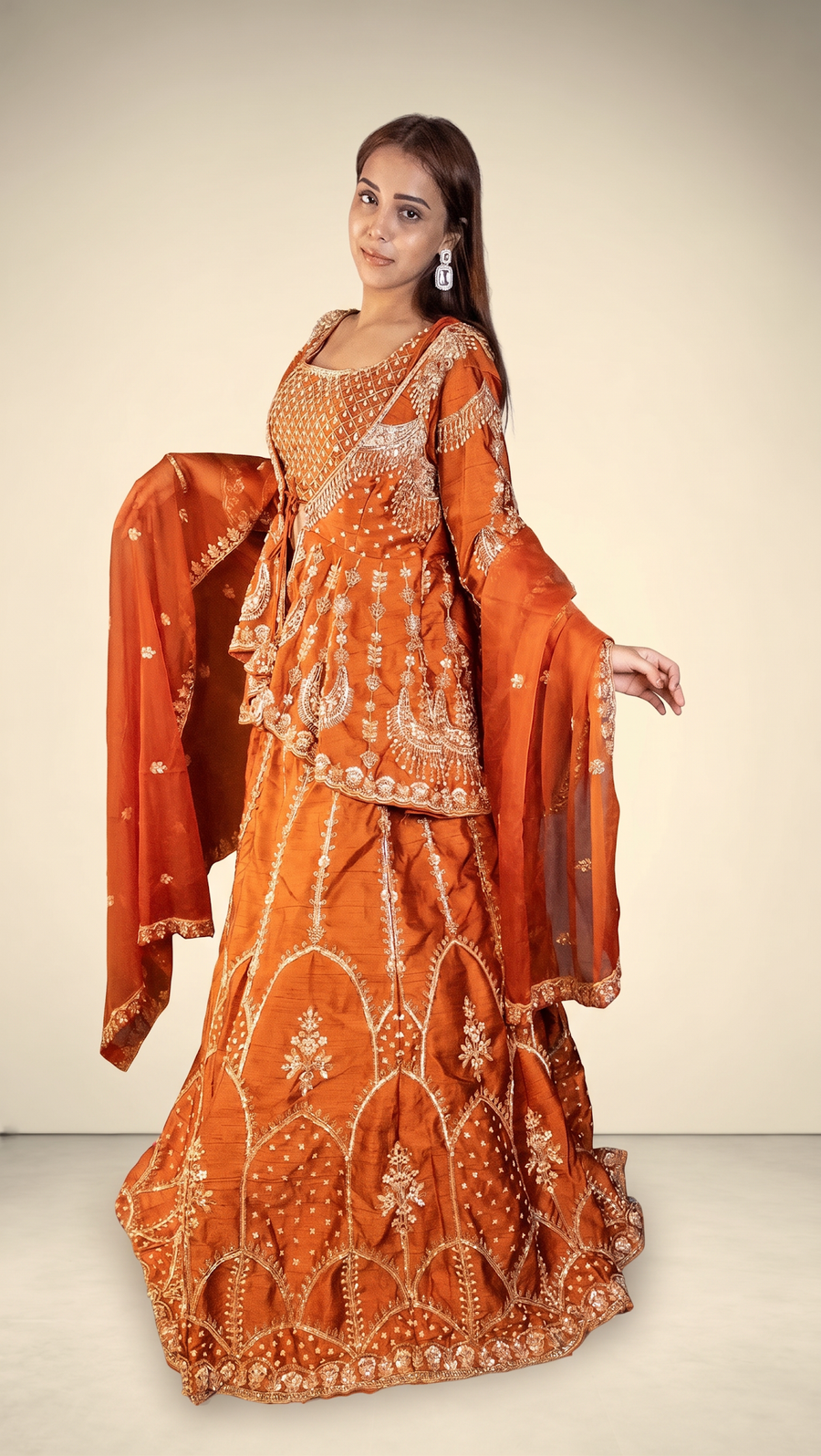 Rust Orange Raw Silk Peplum Jacket Lehenga Set — fabric detail