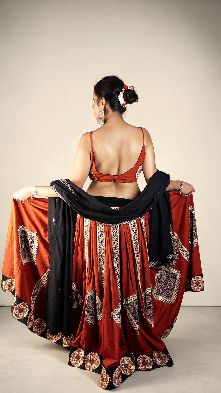 Rust Cotton Flared Kali Lehenga With Mirror Work — back view