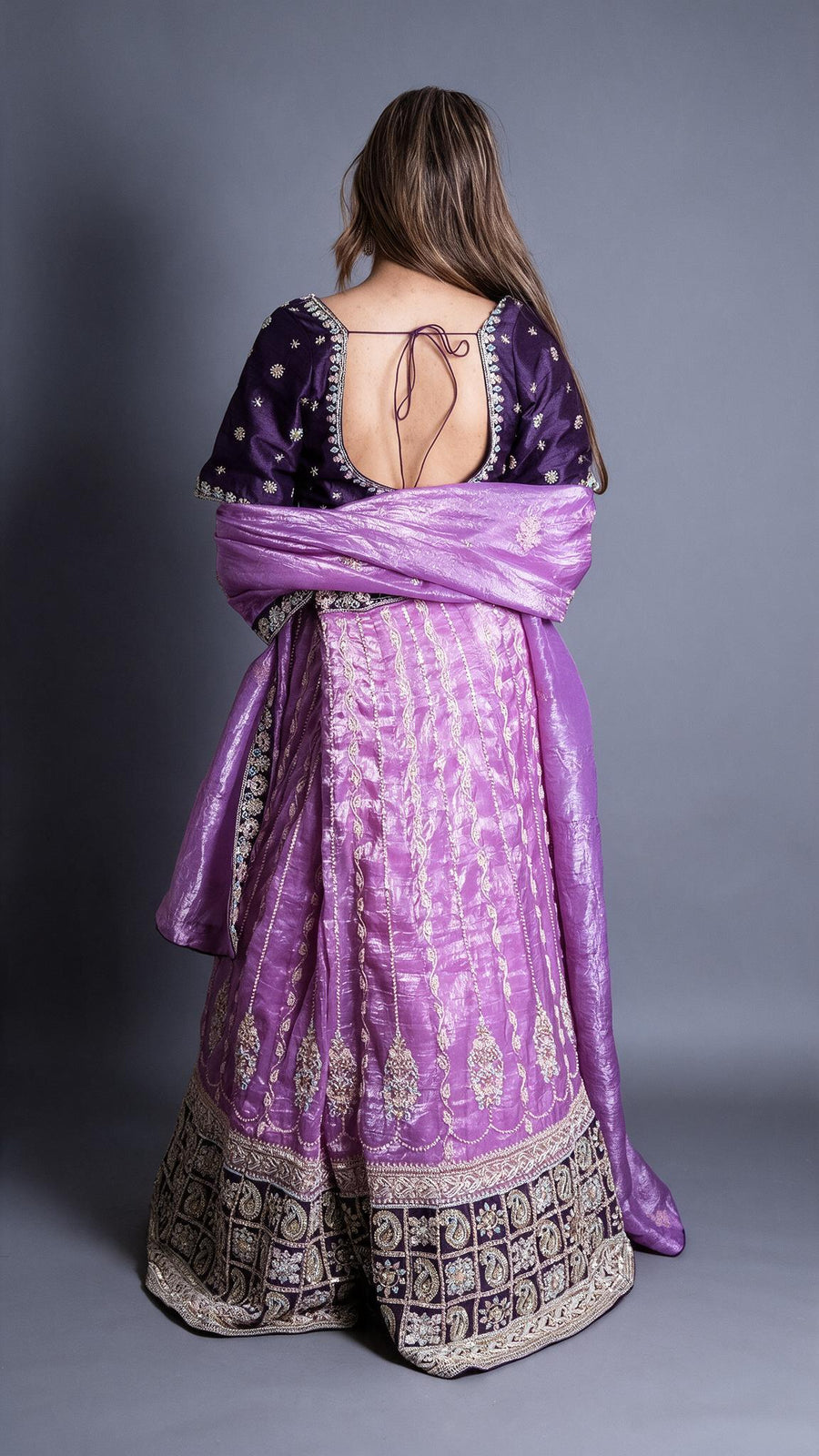 Lilac Tissue Lehenga With Dark Purple Raw Silk Blouse — back view