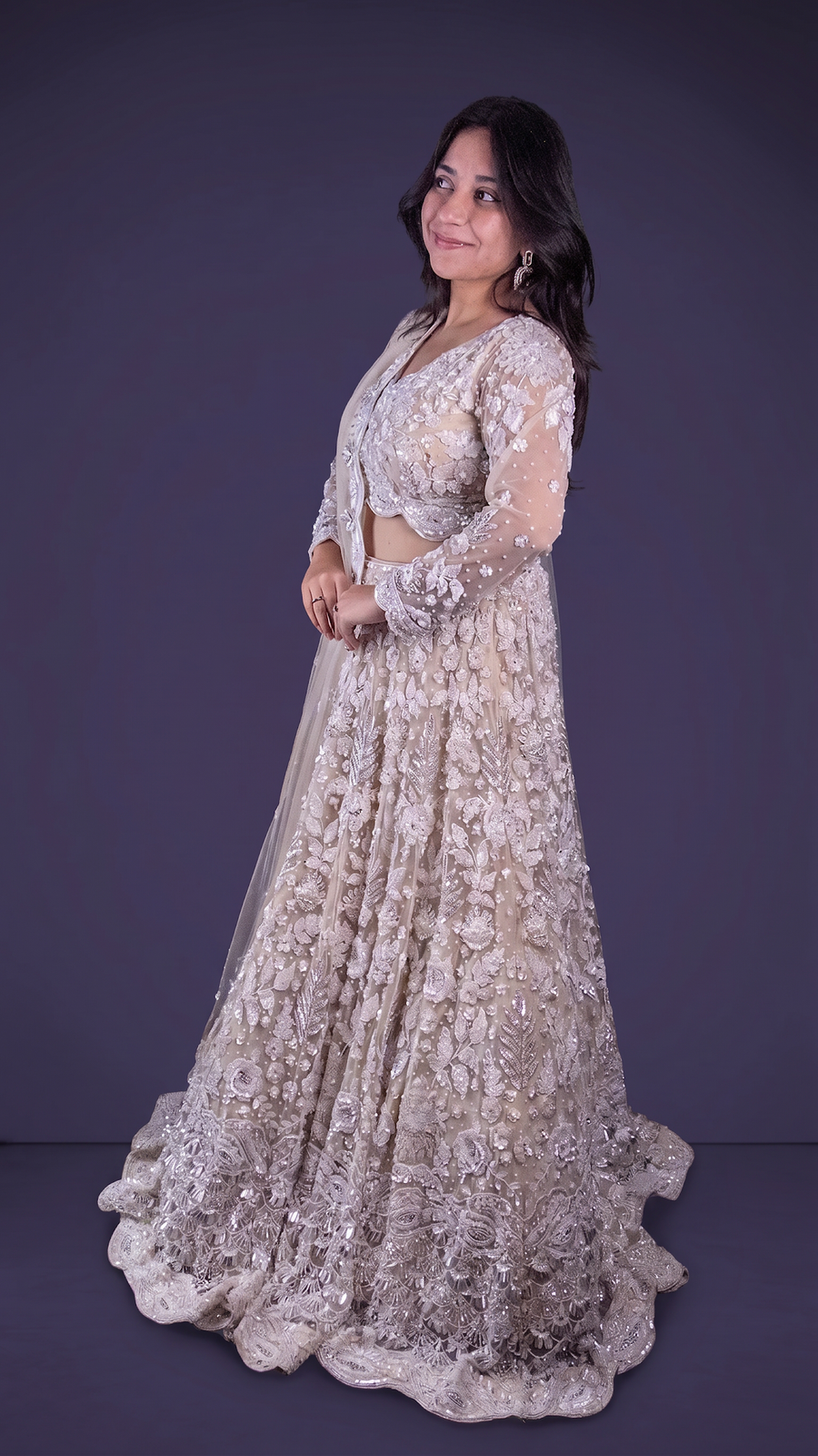 Ivory Net Flared Lehenga With Zari and Cutdana Florals — fabric detail