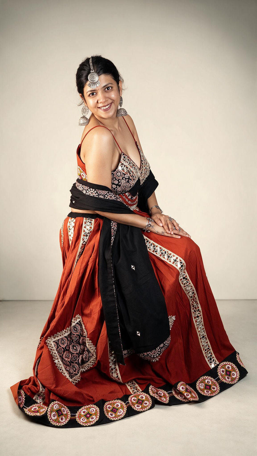 Rust Cotton Flared Kali Lehenga With Mirror Work — fabric detail